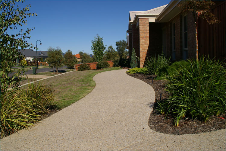 Residential driveway and pathway, landscaped to suit the natural look of this property's garden.